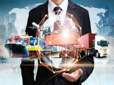 Businessman holding digital globe in palm for logistics import export background and container cargo freight ship transport concept